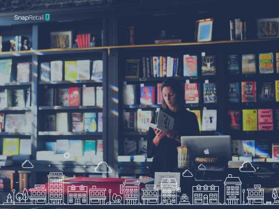 woman at cash register with books